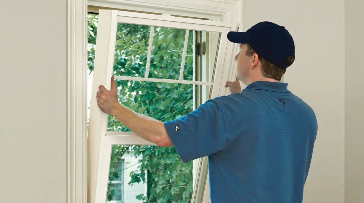 Professional contractors performing a residential window insulation and replacement service in Dallas, TX